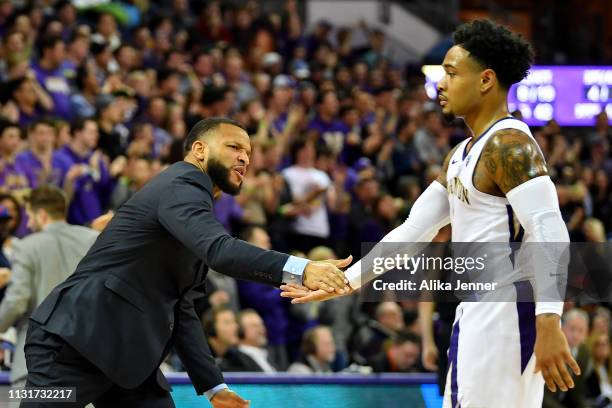 Assistant coach Will Conroy of the Washington Huskies fires up his team in the first half at Hec Edmundson Pavilion on February 23, 2019 in Seattle,...