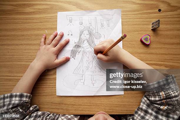 girl drawing - kid hand raised stock pictures, royalty-free photos & images