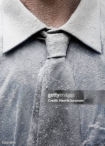 close up of neck tie covered in dust - frozen man stockfoto's en -beelden