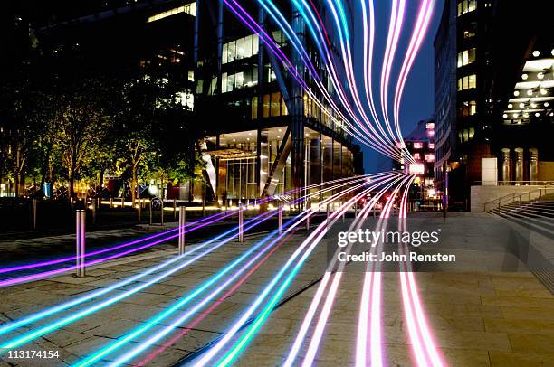 connection with dynamic  fibre optic light trail - rastros de luz fotografías e imágenes de stock