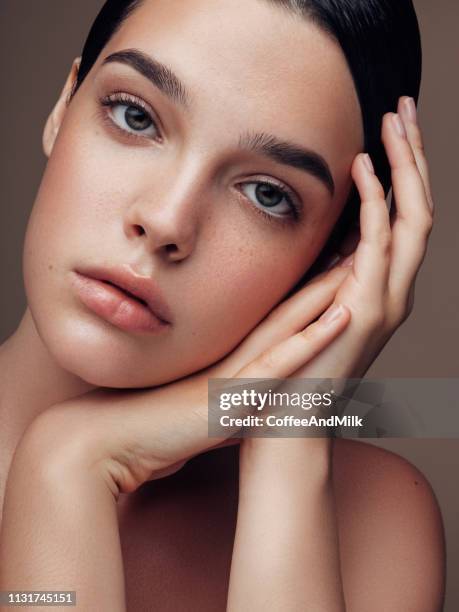 young beautiful woman - brown eyes stock pictures, royalty-free photos & images