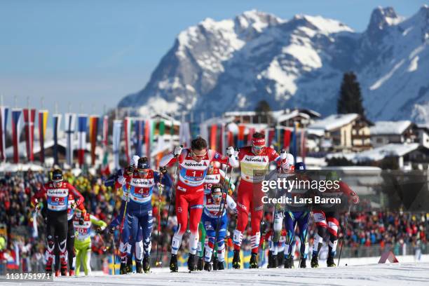 Emil Iversen of Norway, Gleb Retivykh of Russia and Max Hauke of Austria compete in the first semifinal run for the Mens' Cross Country Team Sprint...