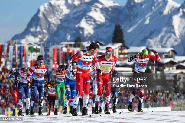 Emil Iversen of Norway, Gleb Retivykh of Russia and Max Hauke of Austria compete in the first semifinal run for the Mens' Cross Country Team Sprint...