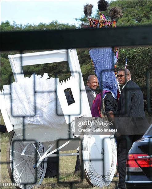 Security personnel surround the rickshaw used to transport the bride and her father during the wedding celebrations for President Jacob Zuma's...