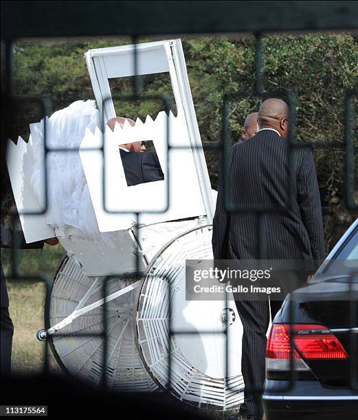 Security personnel surround the rickshaw used to transport the bride and her father during the wedding celebrations for President Jacob Zuma's...