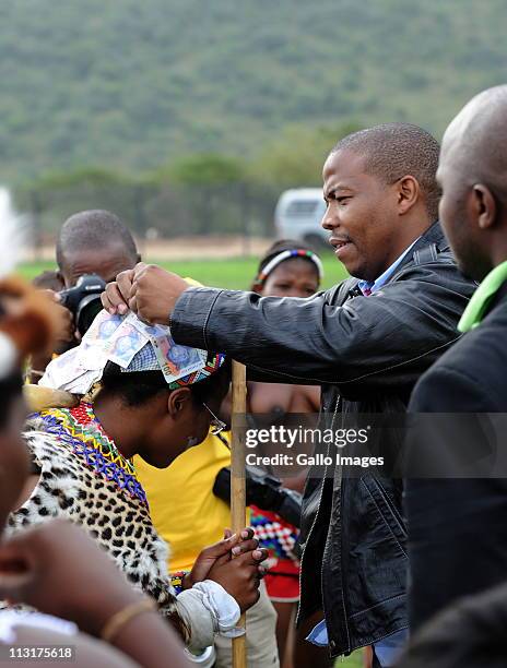 Former head of Lembede Investment Holdings Lonwabo Sambudla stitches money to his bride-to-be, President Jacob Zuma's daughter Duduzile Zuma at her...