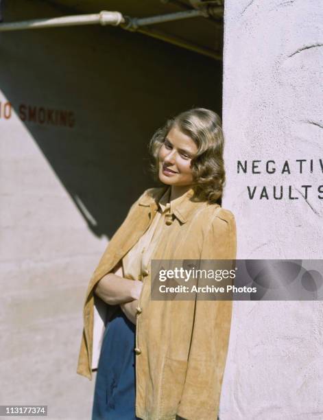 Swedish actress Ingrid Bergman leans against a wall circa 1945.