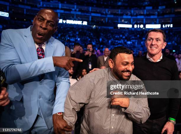 Former boxers Frank Bruno, Prince Naseem Hamed and former jockey Sir Anthony McCoy watch from ringside before the IBO World Super Middleweight Title...