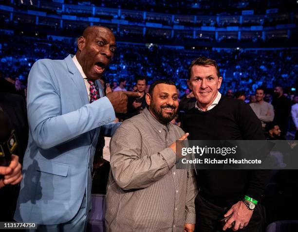 Former boxers Frank Bruno, Prince Naseem Hamed and former jockey Sir Anthony McCoy watch from ringside before the IBO World Super Middleweight Title...
