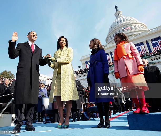 President Barack Obama takes the oath as the 44th U.S. President with his wife, Michelle, by his side at the U.S. Capitol in Washington, D.C.,...