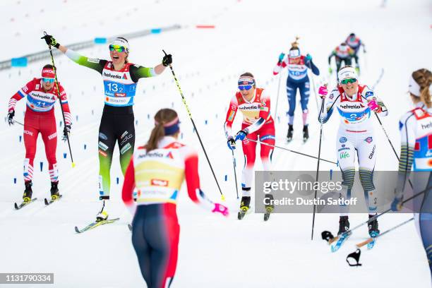 Maja Dahlqvist of Sweden beats Anamarija Lampic of Slovenia and Maiken Caspersen Falla of Norway to the finish line winning first place in the Cross...