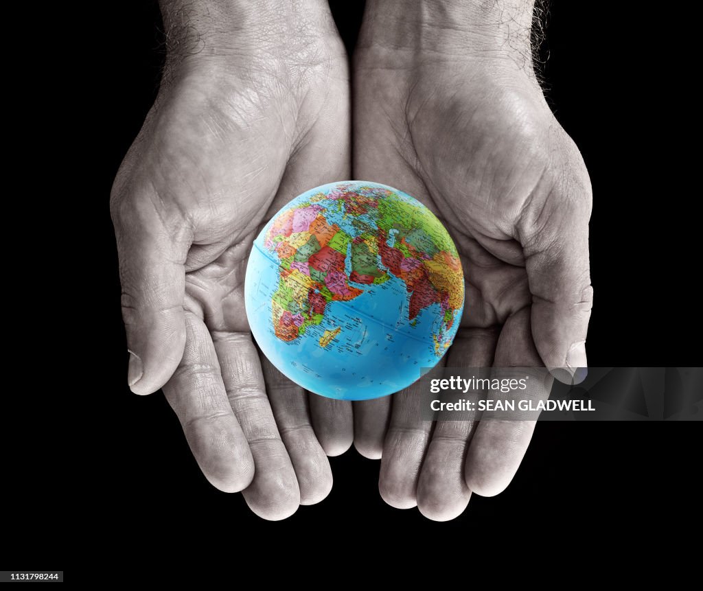 Globe in palm of hands