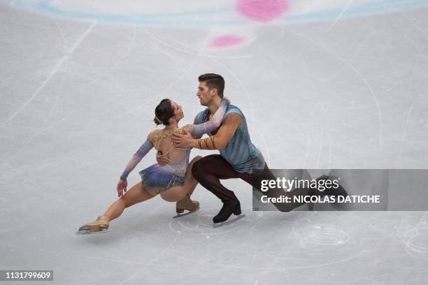Italy's Nicole Della Monica and Matteo Guarise perform in the pairs free program during the world figure skating championships in Saitama on March...