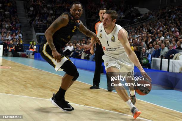 Jaycee Carroll , #20 of Real Madrid and James Nunnally, #21 of AX Armani are seen during the 2018/2019 Turkish Airlines EuroLeague Regular Season...