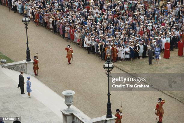 Aerial view of Queen Elizabeth II and Prince Philip greeting guests at a garden party, held at Buckingham Palace, London, England, Great Britain, 26...