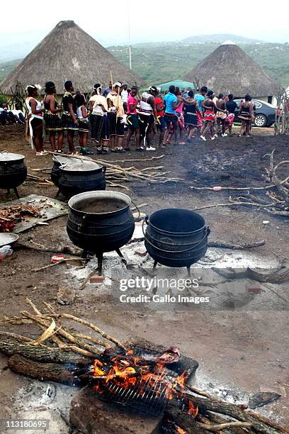 People dance during the joint uMemulo ceremony for President Jacob Zuma daughters' Duduzile and Phumzile at the Zuma homestead in Nkandla on April...