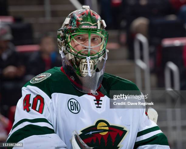 Devan Dubnyk of the Minnesota Wild looks down the ice against the Detroit Red Wings during an NHL game at Little Caesars Arena on February 22, 2019...