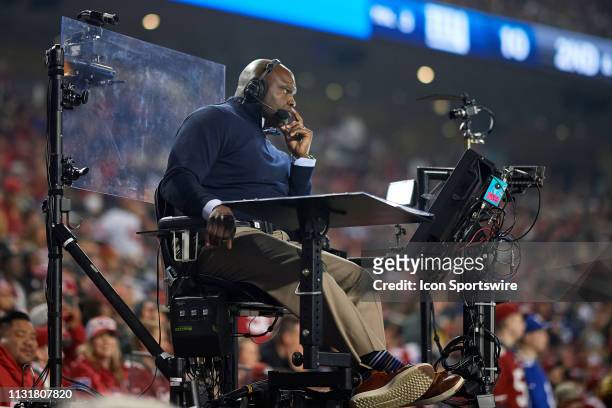 Monday Night Football field commentator Booger McFarland reports the game from his raised field booth during the NFL game between the New York Giants...