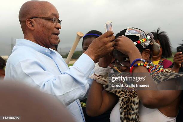 President Jacob Zuma attends the joint uMemulo ceremony for his daughters Phumzile and Duduzile at the Zuma homestead in Nkandla on April 21, 2011 in...