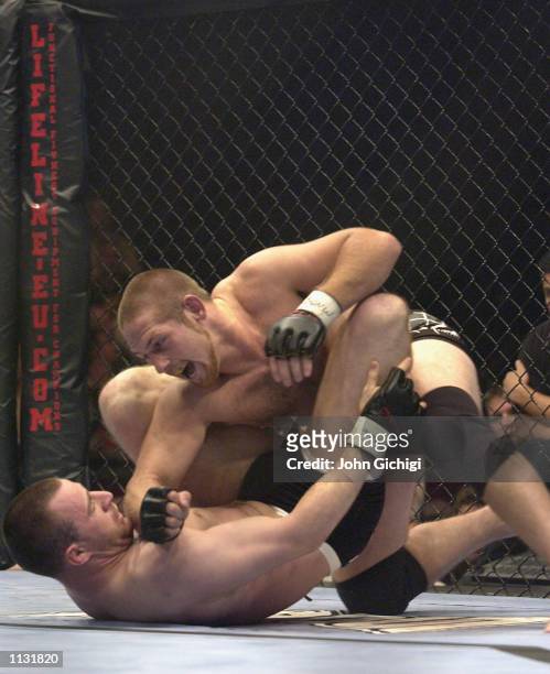 Phillip Miller of the USA battles with James Zikic of Great Britain during the Ultimate Fighting Championship, "Brawl in the Royal Albert Hall", in...
