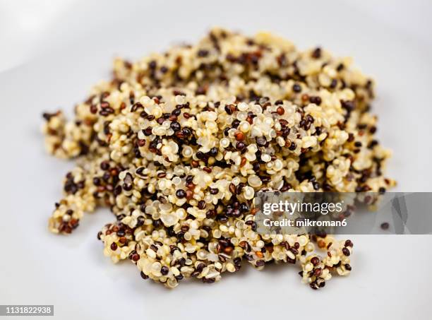 dish of cooked white,red and black quinoa, super-food (chenopodium quinoa) - quinua fotografías e imágenes de stock