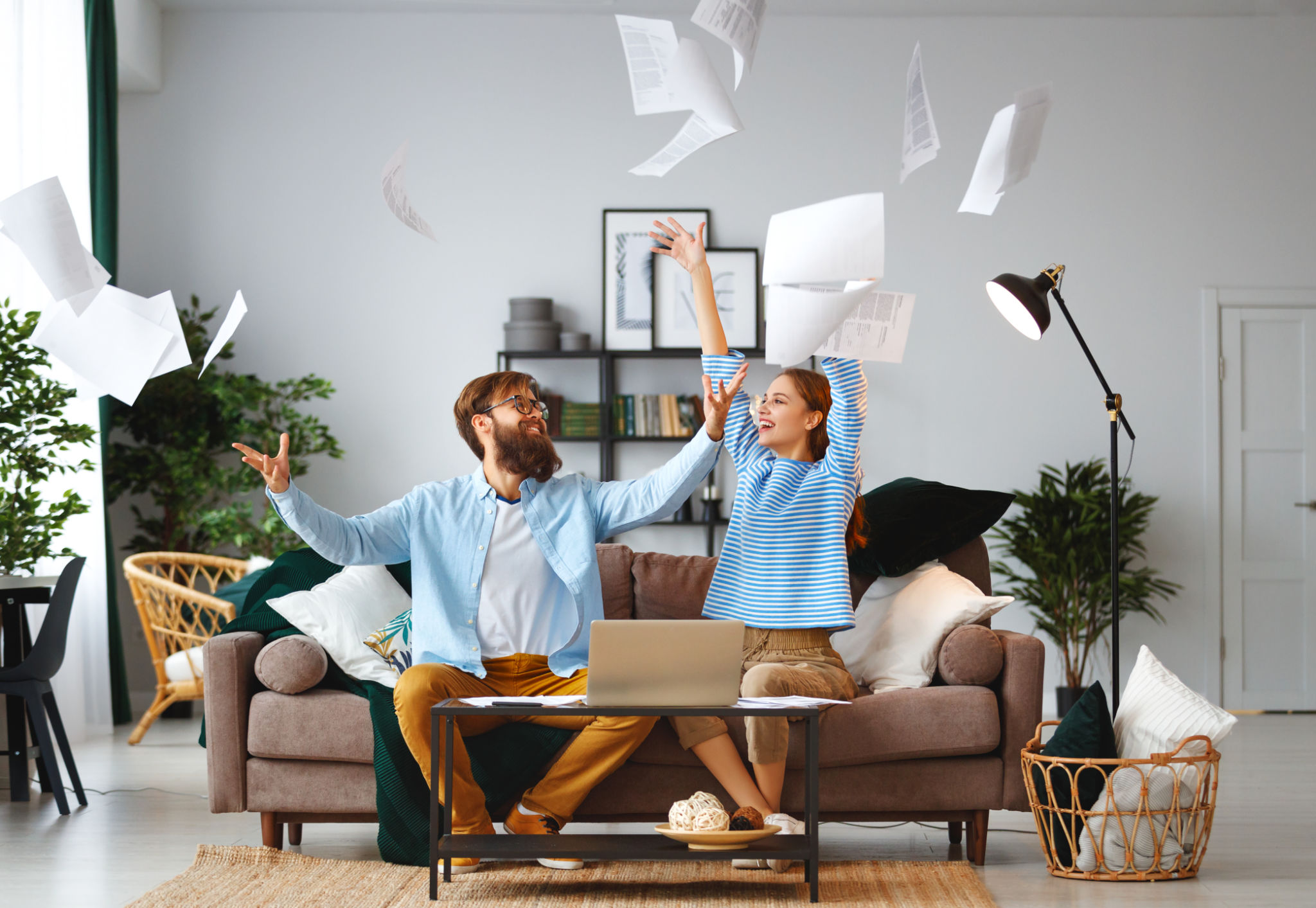 married couple with bills receipts documents and laptop at home married couple with bills receipts documents and laptop at home