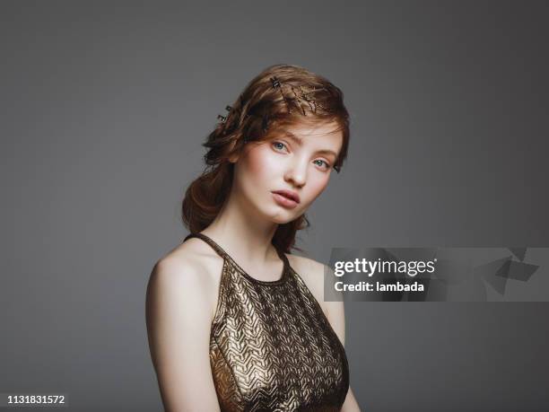 woman with creative hairstyle - gold dress stock pictures, royalty-free photos & images