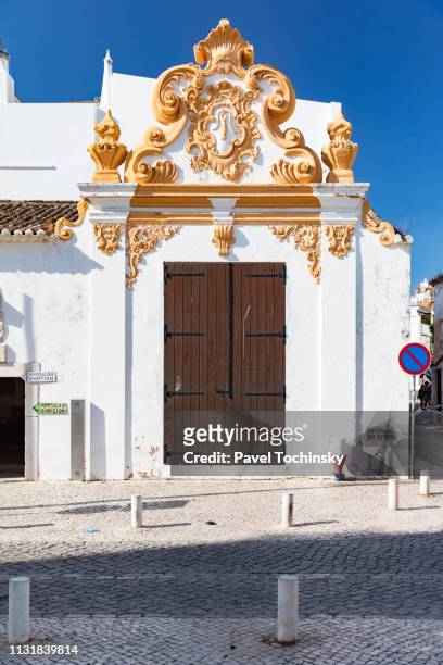 elaborate baroque doorway to armazém regimental in lagos, algarve coast, portugal - armazém stock pictures, royalty-free photos & images