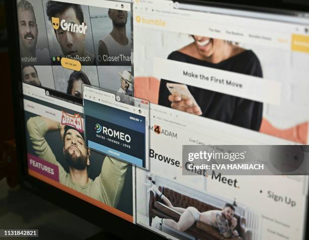 Photo illustration taken March 21, 2019 in Washington, DC, shows the opening pages of the dating sites Bumble, Grindr, Jackd, Gayromeo, and...