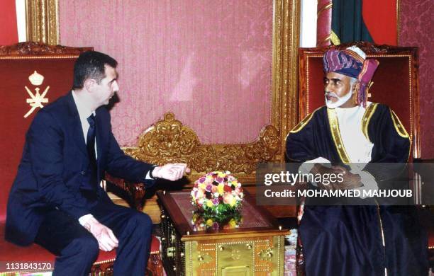 Oman's ruler Sultan Qaboos meets with Syrian President Bashar al-Assad in Muscat 12 May 2001. The two leaders are expected to discuss "ways of...