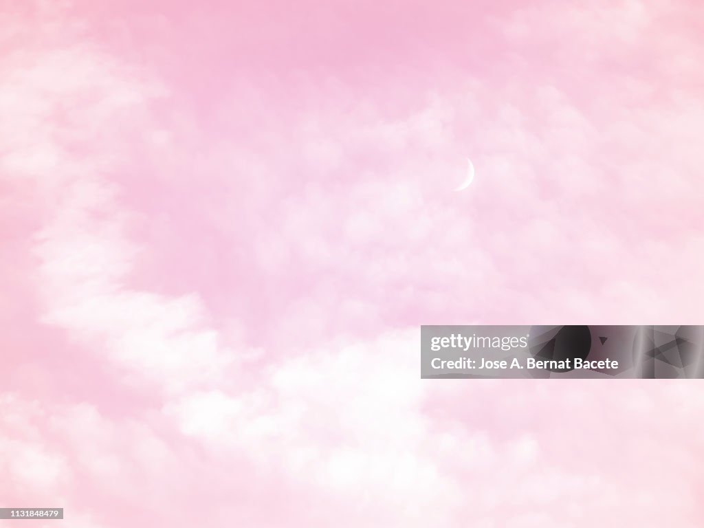 Background of a sky of pink soft color with white clouds.