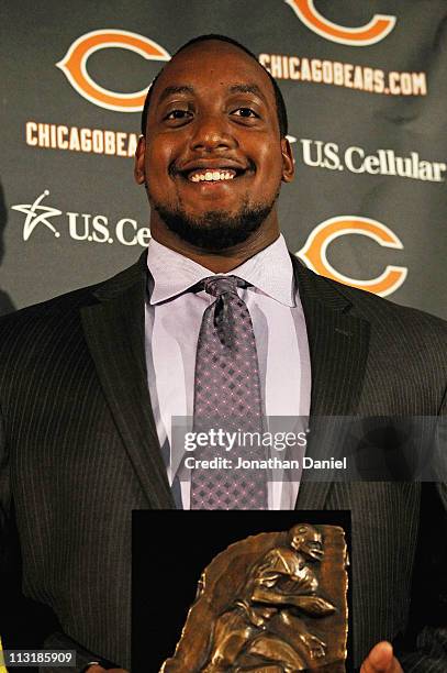 Defensive tackle J'Marcus Webb of the Chicago Bears poses with his award during the 2010 Brian Piccolo Award ceremony at Halas Hall on April 26, 2011...