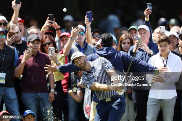 Dustin Johnson of the United States plays a shot on the second hole during the final round of World Golf Championships-Mexico Championship at Club de...