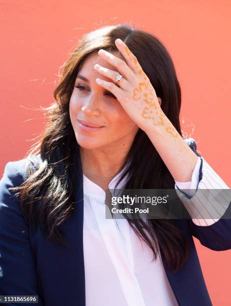 Meghan, Duchess of Sussex attends an Investiture for Michael McHugo the founder of 'Education for All' with the Most Excellent Order of the British...