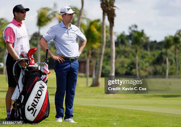 Martin Trainer Martin Trainer and his caddie look on from the third fairway during ...