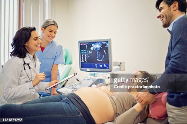 doctor is screening pregnant woman in the hospital - film and television screening stock pictures, royalty-free photos & images