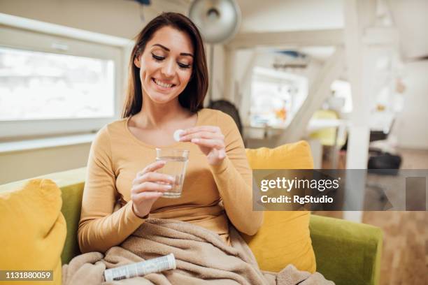 woman having effervescent pill - effervescent tablet stock pictures, royalty-free photos & images