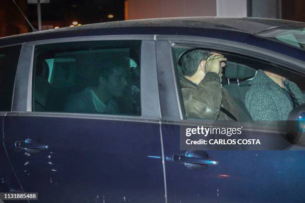 Football Leaks website whistleblower, Rui Pinto , arrives in an unmarked police car at the police headquarters in Lisbon on March 21, 2019. Rui...