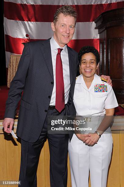 Jim Purvis and honoree Rear Admiral Michelle Howard attend the USO 45th Annual Woman Of The Year Luncheon honoring Military Women and Women Business...