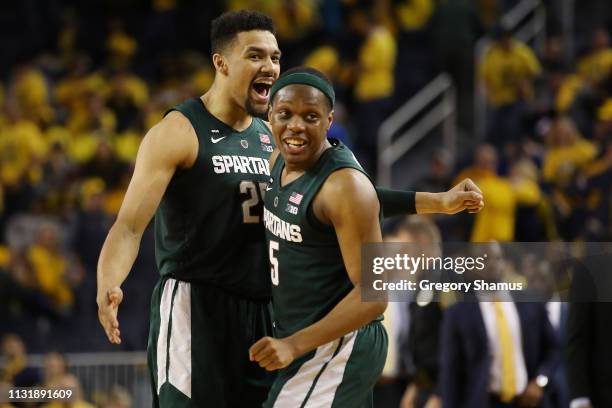 Cassius Winston and Kenny Goins of the Michigan State Spartans react after a 77-70 win over the Michigan Wolverines at Crisler Arena on February 24,...