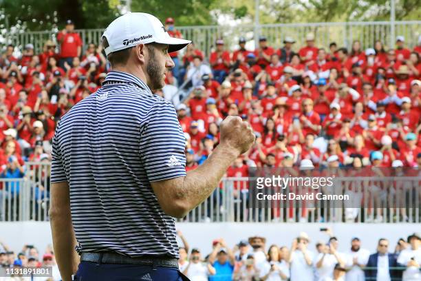 Dustin Johnson of the United States celebrates on the 18th green after making a par to win the World Golf Championships-Mexico Championship at Club...