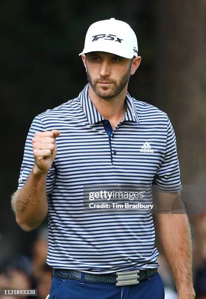 Dustin Johnson of the United States celebrates on the 18th green after making a par to win the World Golf Championships-Mexico Championship at Club...