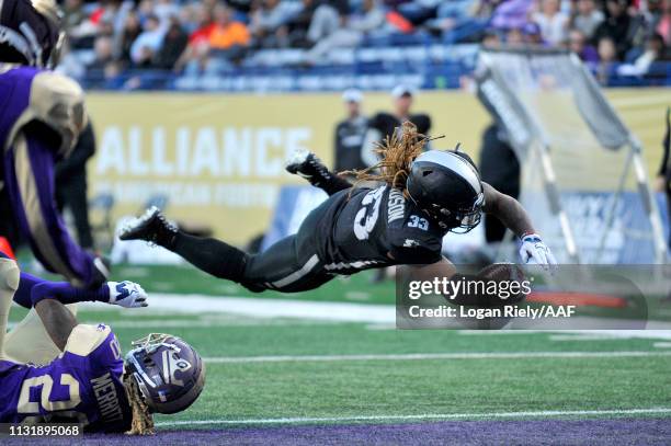 Trent Richardson of Birmingham Iron scores a touchdown against the Atlanta Legends during the third quarter of the Alliance of American Football game...