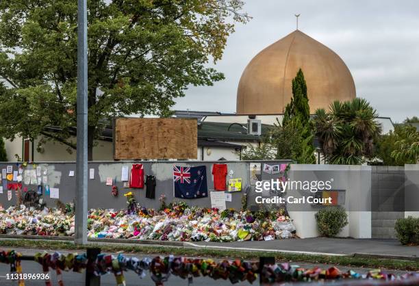 Flowers and tributes are laid outside Al Noor mosque, on March 22, 2019 in Christchurch, New Zealand. 50 people were killed, and dozens were injured...