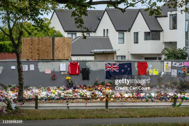 Flowers and tributes are laid outside Al Noor mosque, on March 22, 2019 in Christchurch, New Zealand. 50 people were killed, and dozens were injured...