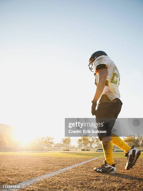 hispanic football player walking on football field - safety american football player 個照片及圖片檔