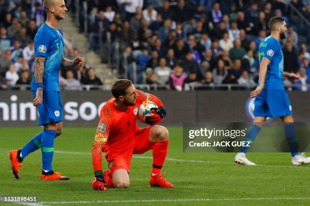 Slovenia's goalkeeper Jan Oblak catches the ball during the Euro 2020 Group G football qualification match between Israel and Slovenia in at the...