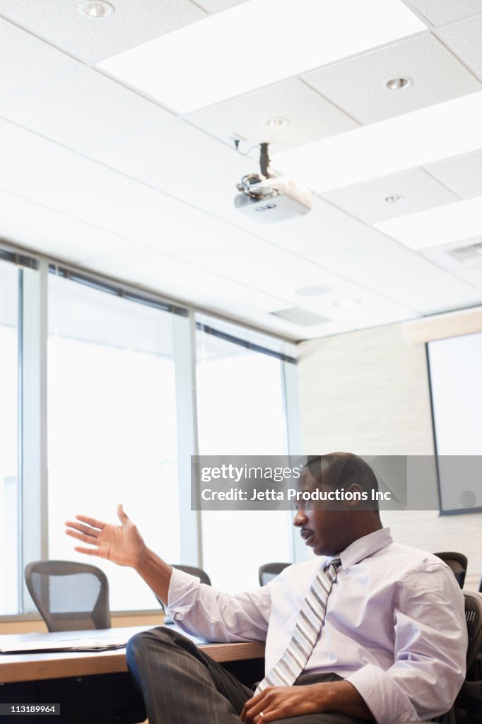 Black businessman talking in conference room