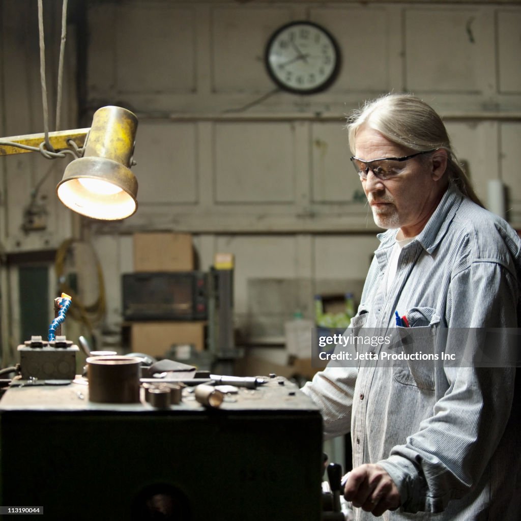 Caucasian worker working on factory