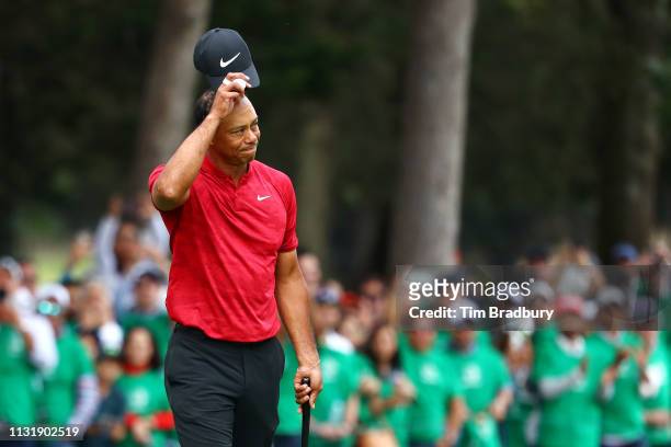 Tiger Woods of the United States acknowledges the crowd after finishing on the 18th green during the final round of World Golf Championships-Mexico...